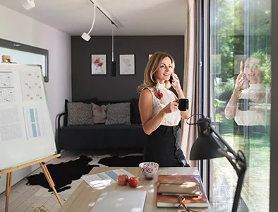 Quiet home office extension with built-in desk, shelving, and garden view — Betta Space